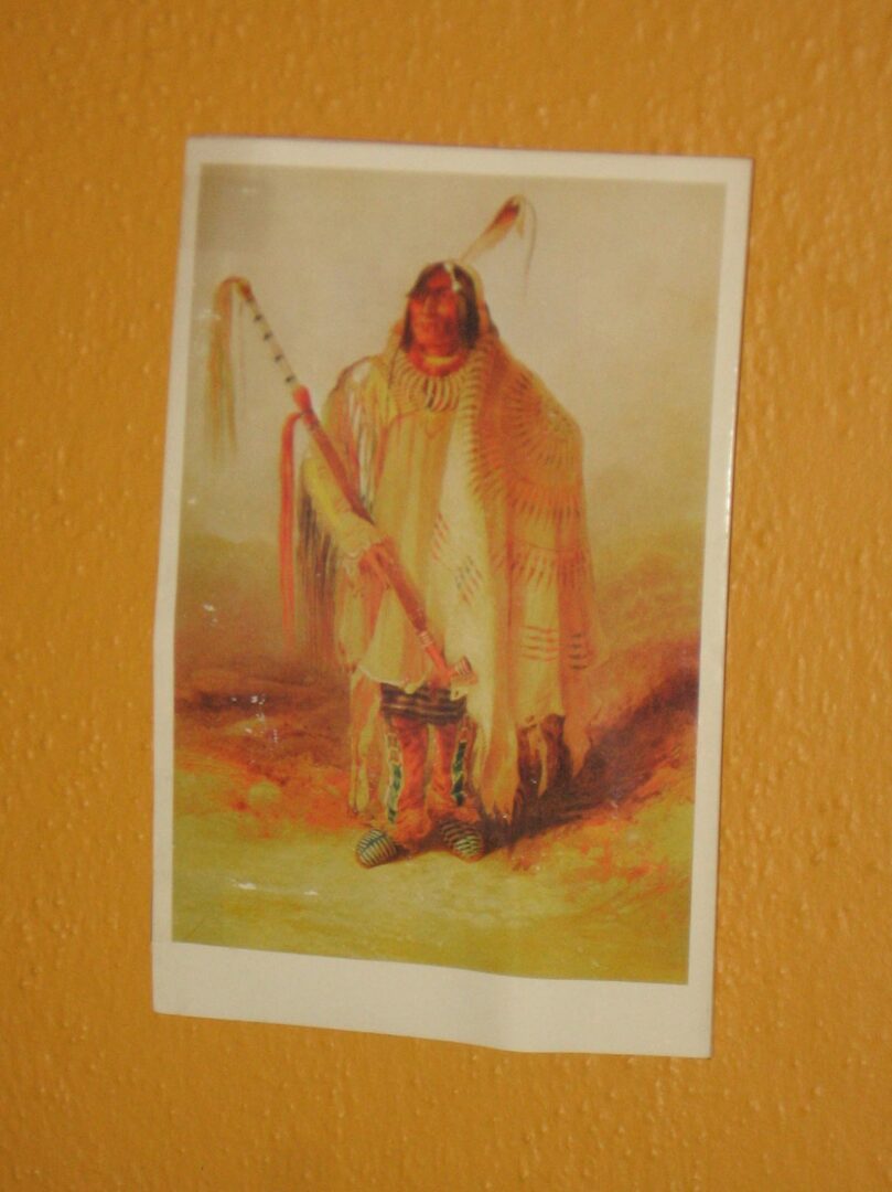 A painting of an indian with a spear.