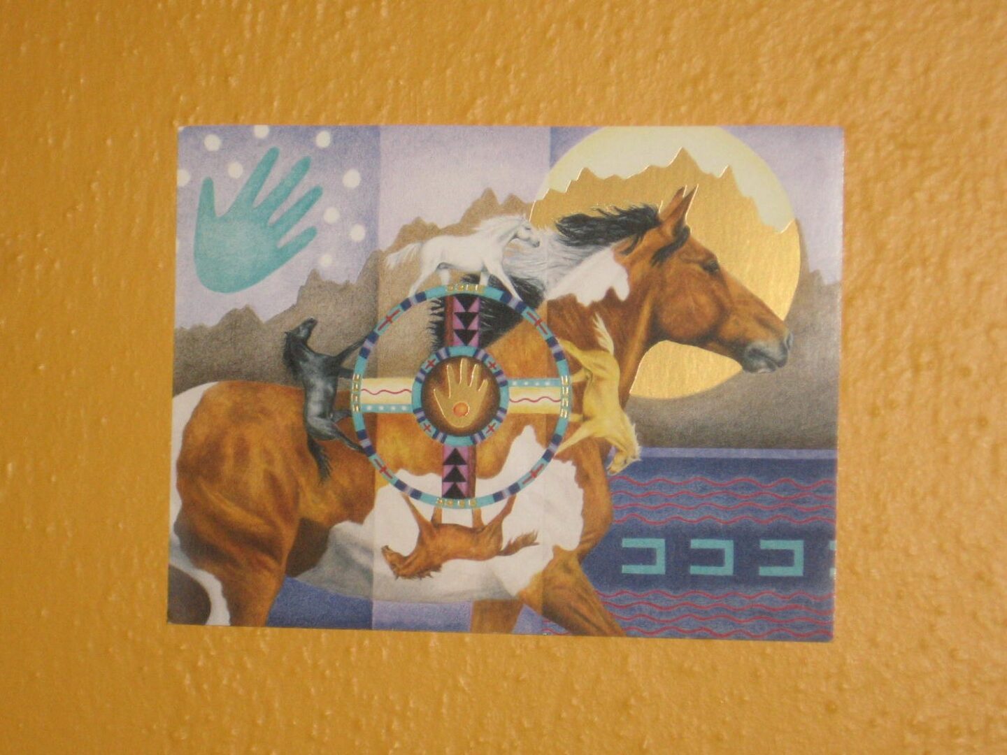 A painting of a horse and rider on the wall.