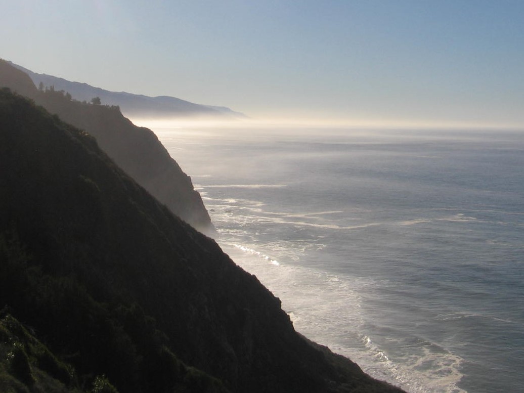 A view of the ocean from a cliff.