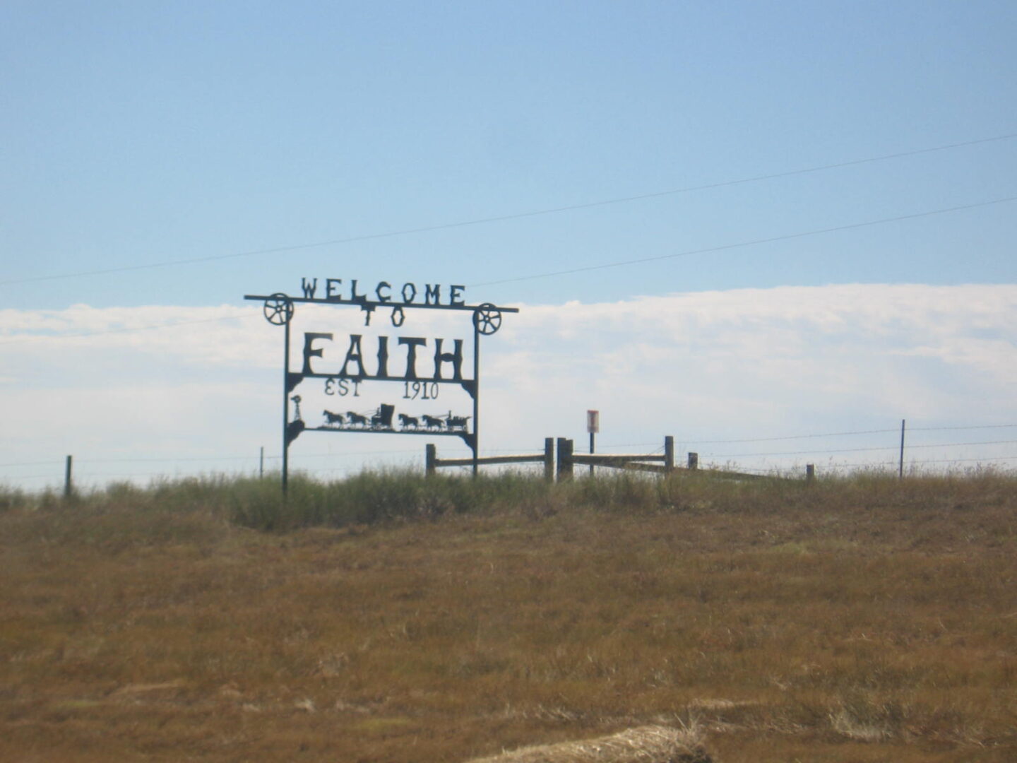 A sign that says welcome to faith