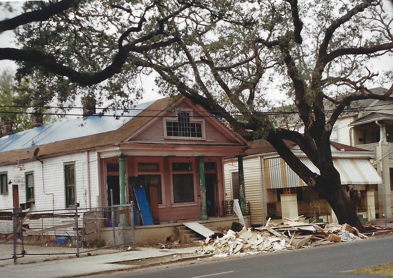 A house that is being demolished by the side of it.