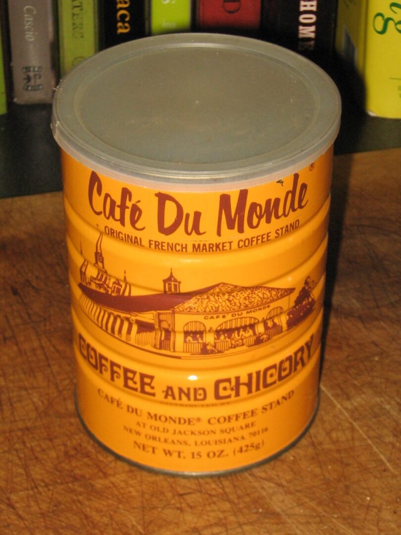 A coffee can sitting on top of a wooden table.