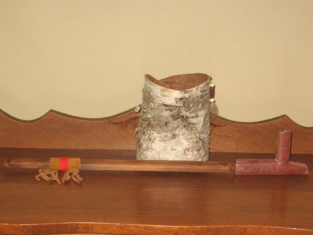 A wooden table with a bag on top of it