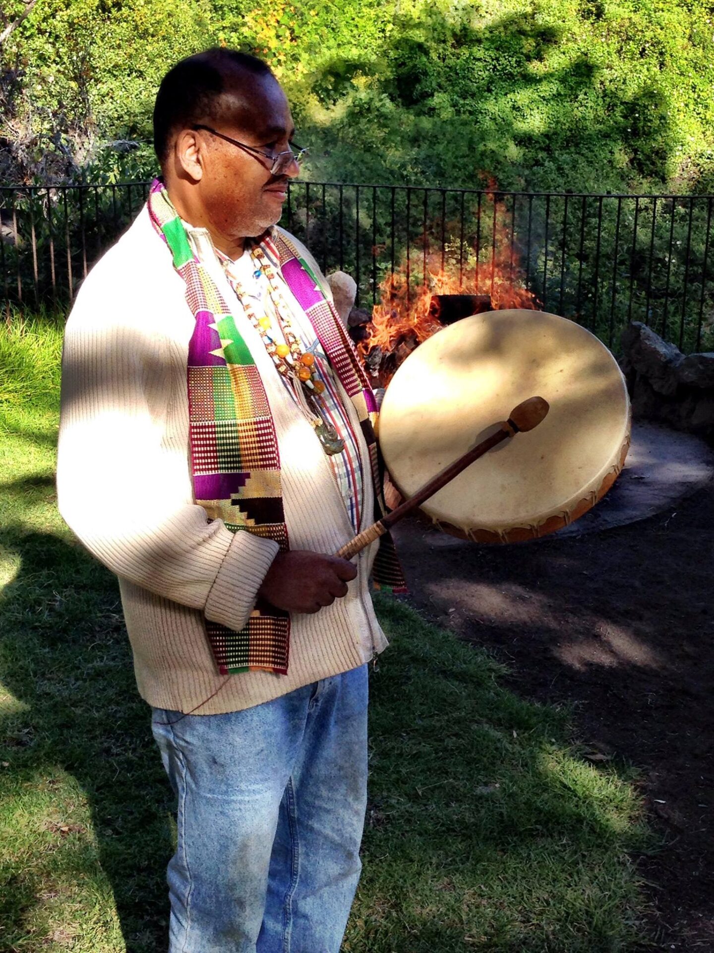 A man holding a drum in his hands.
