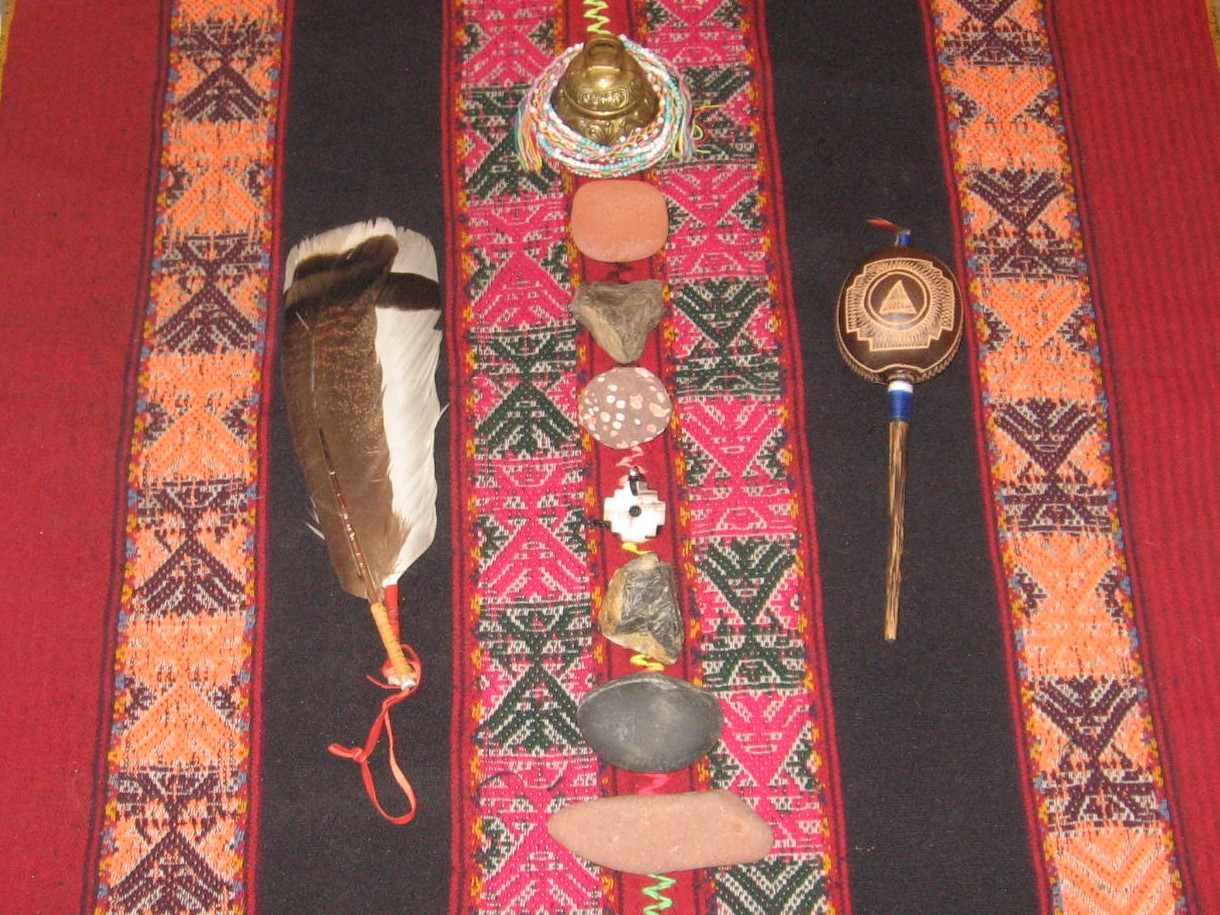 A table with various items on it and a feather.