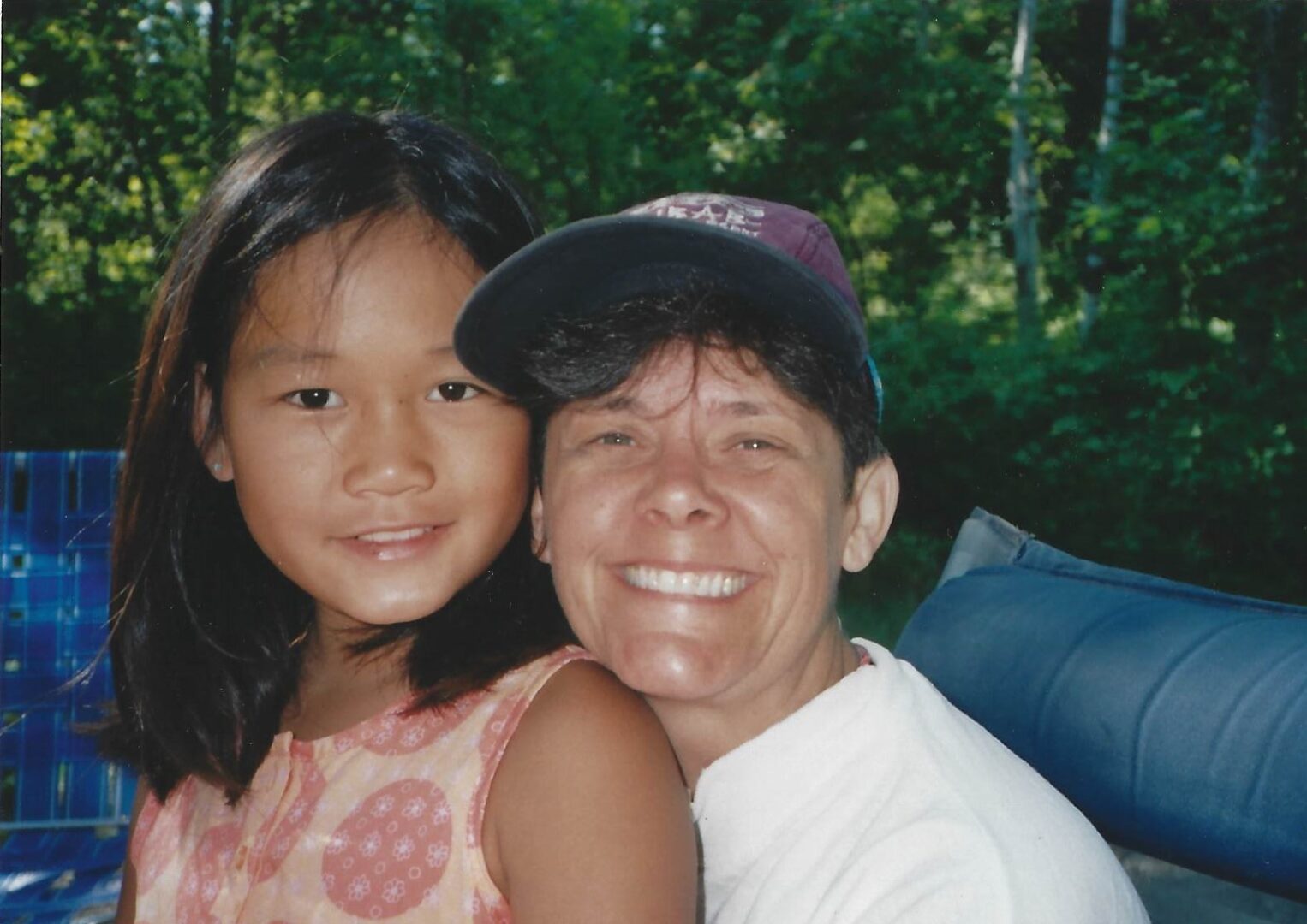 A woman and girl smiling for the camera.