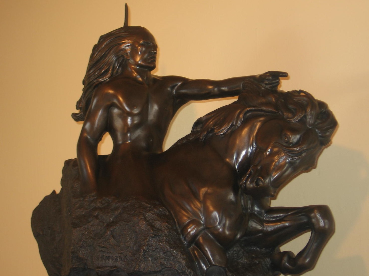 A statue of a woman on top of a horse.