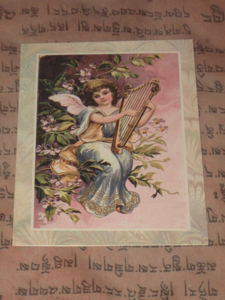 A painting of an angel holding a harp.