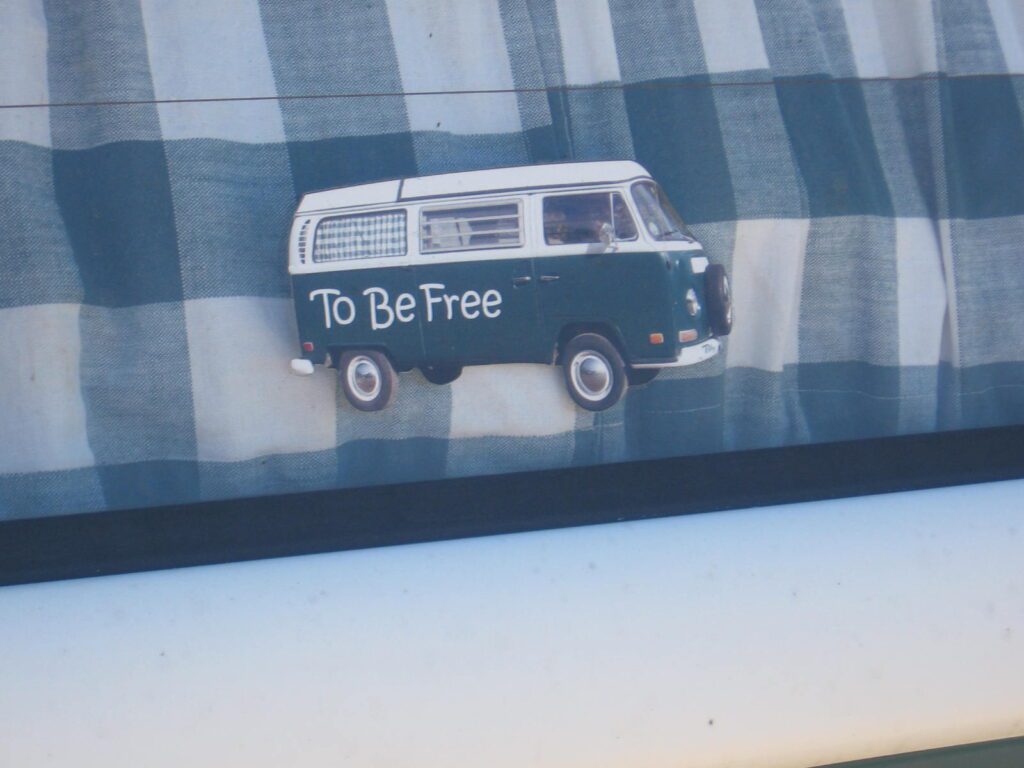 A van with the words " to be free " on it.