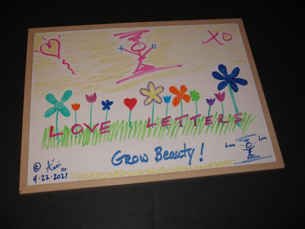 A picture of some flowers and grass with the words " love letters grow beauty ".