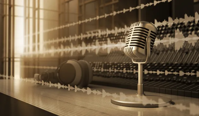 A microphone is on the stand in front of some sound waves.