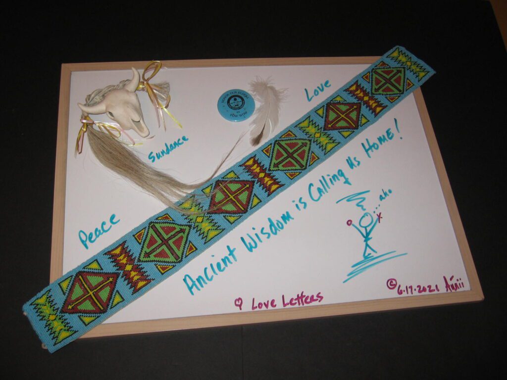 A card with a ribbon and some other items