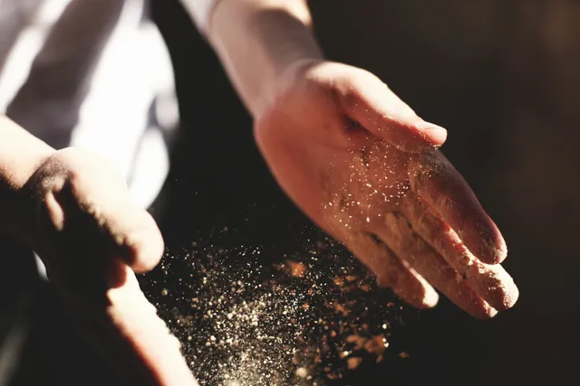 A person reaching out to shake hands with another