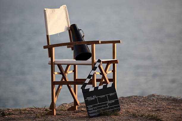 A chair with a movie camera sitting on it