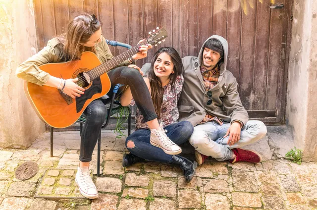 woman playing guitar