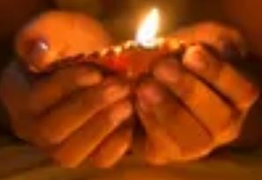 Small Hands holding a candle